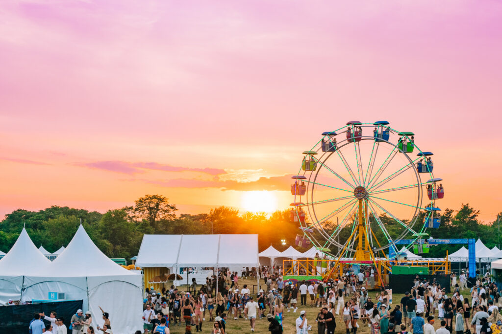 Outdoor music festival crowd at sunset in the Hamptons, Hampton Bays, NY