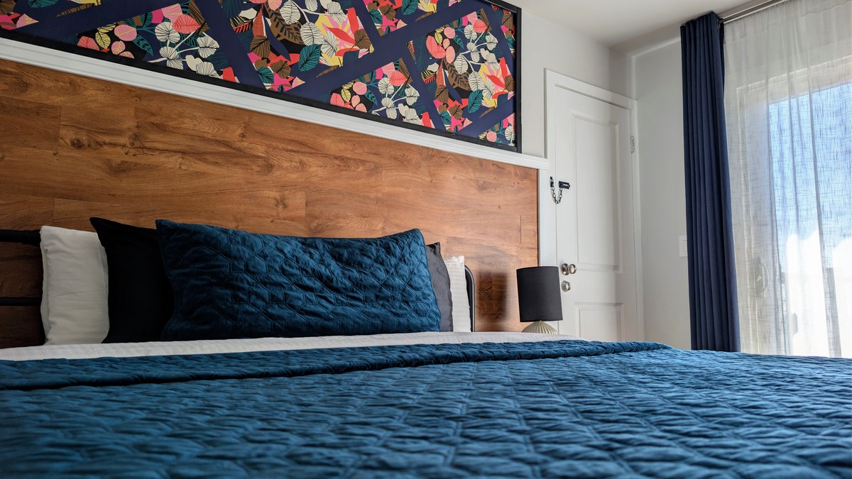 Cottage King room with bay views and pool deck at Ocean View Terrace Inn, Hampton Bays, NY