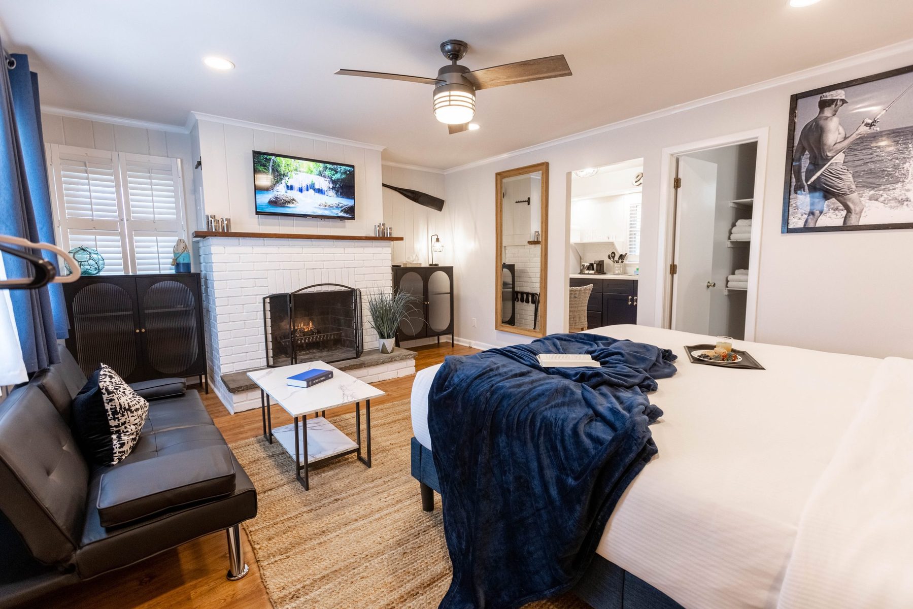 Deluxe King Suite at Ocean View Terrace Inn featuring king bed, fireplace, and full kitchen, Hampton Bays, NY