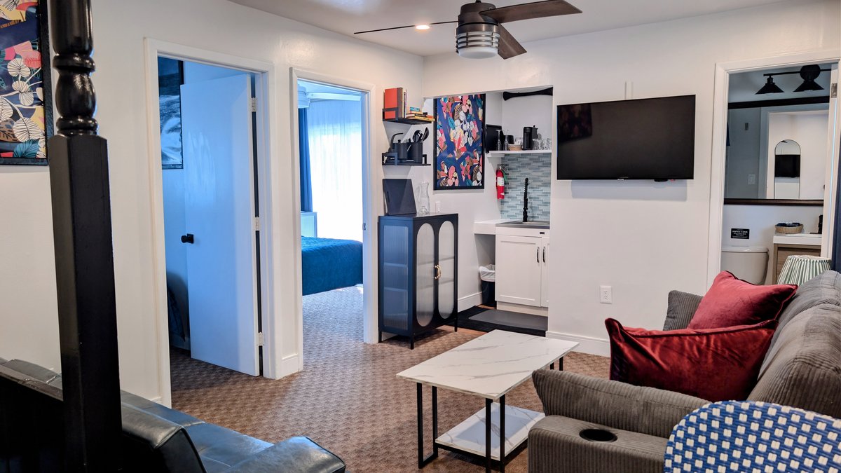 Deluxe Two Bedroom Suite at Ocean View Terrace Inn with queen bed, twin beds, balcony, and water views, Hampton Bays, NY